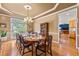 Bright dining room features hardwood floors, a modern chandelier, and a full dining set ready for entertaining at 3052 Fleet Sw St, Marietta, GA 30064