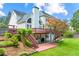 Spacious backyard with multilevel deck and patio featuring an outdoor living area with mature trees and landscaping at 3052 Fleet Sw St, Marietta, GA 30064