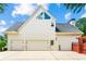 Spacious three car garage featuring neutral paint and a peaked roof with a modern window at 3052 Fleet Sw St, Marietta, GA 30064