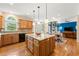 Spacious kitchen features hardwood floors, stainless appliances, granite countertops, and a large center island at 3052 Fleet Sw St, Marietta, GA 30064