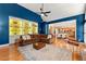 Open living room with hardwood floors, custom built-in shelves, and lots of sunlight at 3052 Fleet Sw St, Marietta, GA 30064