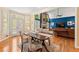 Bright kitchen flows into a dining space and living room filled with natural light and hardwood floors throughout at 3052 Fleet Sw St, Marietta, GA 30064