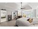 Spacious main bedroom featuring tray ceiling, sitting area, and ensuite bathroom at 3052 Fleet Sw St, Marietta, GA 30064