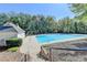 Enjoy the outdoors with this refreshing community pool surrounded by lush green trees and open sky at 3052 Fleet Sw St, Marietta, GA 30064