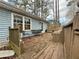 Relaxing back deck featuring a small dining table set and bench seating at 712 Copper Trace Way, Woodstock, GA 30189