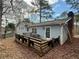 Cozy backyard features a deck and small table set, perfect for outdoor relaxation and entertaining at 712 Copper Trace Way, Woodstock, GA 30189
