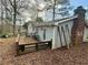 Backyard featuring a wooden deck and a brick chimney at 712 Copper Trace Way, Woodstock, GA 30189