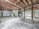 Unfinished basement with exposed beams, concrete floor, and staircase at 712 Copper Trace Way, Woodstock, GA 30189
