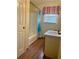 Bathroom featuring a single sink vanity, and a shower-tub combo with a curtain and a window at 712 Copper Trace Way, Woodstock, GA 30189