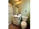 Bathroom with white cabinet sink, toilet, and shower-tub with glass door at 712 Copper Trace Way, Woodstock, GA 30189