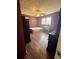 Bedroom with laminate flooring, ceiling fan, window, desk, and closet at 712 Copper Trace Way, Woodstock, GA 30189