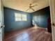 Bedroom featuring a ceiling fan, laminate flooring, natural light, and spacious layout at 712 Copper Trace Way, Woodstock, GA 30189