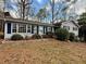 Charming single-story home with blue siding, shutters, and a landscaped front yard at 712 Copper Trace Way, Woodstock, GA 30189