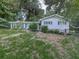 Inviting one-story home with a well-manicured lawn and lovely front yard bushes and trees at 712 Copper Trace Way, Woodstock, GA 30189