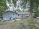 Back exterior of home with a spacious deck perfect for outdoor relaxation and entertainment at 712 Copper Trace Way, Woodstock, GA 30189