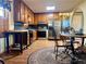 Well-lit kitchen featuring stainless steel appliances, wooden cabinets and a breakfast nook with a round table at 712 Copper Trace Way, Woodstock, GA 30189