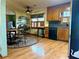 Bright kitchen featuring wood cabinets, a round dining table, and stainless steel appliances at 712 Copper Trace Way, Woodstock, GA 30189