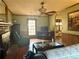 Spacious living room featuring a brick fireplace, hardwood floors, and a view to the backyard at 712 Copper Trace Way, Woodstock, GA 30189