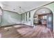 The living room features wood flooring, arched entryways, and a chandelier for an elegant touch at 712 Copper Trace Way, Woodstock, GA 30189