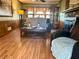 Comfortable living room with hardwood floors, a brick fireplace, and traditional decor at 712 Copper Trace Way, Woodstock, GA 30189