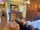 Spacious main bedroom featuring a wooden dresser with mirror and large closet with hardwood flooring at 712 Copper Trace Way, Woodstock, GA 30189