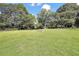Expansive backyard with lush green grass, providing ample space for outdoor activities at 107 Gwenellen Dr, Locust Grove, GA 30248