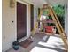 Cozy front porch featuring a hanging swing, creating a welcoming and relaxing outdoor space at 107 Gwenellen Dr, Locust Grove, GA 30248