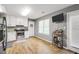Well-appointed kitchen with stainless steel appliances, white cabinets, and hardwood floors at 107 Gwenellen Dr, Locust Grove, GA 30248