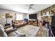 Inviting living room showcasing a stone fireplace, comfortable seating, and ample natural light at 107 Gwenellen Dr, Locust Grove, GA 30248