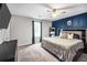 Comfortable main bedroom features a ceiling fan, a large bed, and soothing color palette at 107 Gwenellen Dr, Locust Grove, GA 30248