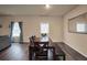 Dining area adjacent to the living room and kitchen at 157 Oliver Dr, Locust Grove, GA 30248