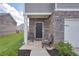Inviting front porch with seating and stone accents at 157 Oliver Dr, Locust Grove, GA 30248