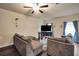 Spacious living room featuring a comfortable sectional sofa at 157 Oliver Dr, Locust Grove, GA 30248