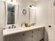 Bathroom showcasing double sinks with white countertops, and modern fixtures at 173 Price Rd, Brooks, GA 30205