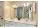 Bathroom featuring a double vanity with mirrors, bright lighting, and updated fixtures at 173 Price Rd, Brooks, GA 30205