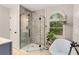 Bright bathroom features a glass-enclosed shower and separate soaking tub at 173 Price Rd, Brooks, GA 30205
