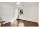 A light and airy bedroom with hardwood floors, a large window and a ceiling fan at 173 Price Rd, Brooks, GA 30205