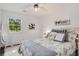 Bright bedroom with hardwood floors, modern decor, a comfortable bed, and a large window at 173 Price Rd, Brooks, GA 30205