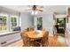Dining room with hardwood floors, bright windows, and a ceiling fan at 173 Price Rd, Brooks, GA 30205