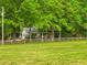 Charming two-story home with red shutters and a long split rail fence at 173 Price Rd, Brooks, GA 30205