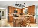 Well-equipped kitchen with granite countertops, wooden cabinets, and a center island with seating at 173 Price Rd, Brooks, GA 30205
