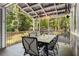 Covered outdoor patio perfect for dining, featuring a large table and comfortable seating at 173 Price Rd, Brooks, GA 30205