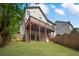 Expansive backyard featuring lush green grass, a patio, and a two-story deck at 2548 Kickerillo Se Way, Atlanta, GA 30316