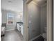 Bathroom with tiled floors, double sinks, and a soaking tub at 2548 Kickerillo Se Way, Atlanta, GA 30316
