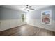 Bedroom featuring hardwood floors, neutral walls, and bright natural light at 2548 Kickerillo Se Way, Atlanta, GA 30316