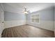 Bedroom featuring hardwood floors, a ceiling fan, and a window at 2548 Kickerillo Se Way, Atlanta, GA 30316