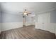 Bedroom featuring hardwood floors, a ceiling fan, and walk-in closet at 2548 Kickerillo Se Way, Atlanta, GA 30316