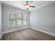 Bright bedroom with a ceiling fan, and sleek grey flooring, and natural light at 2548 Kickerillo Se Way, Atlanta, GA 30316