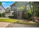 Beautiful two-story home with manicured lawn, mature trees, and a welcoming entrance in a serene neighborhood at 2548 Kickerillo Se Way, Atlanta, GA 30316