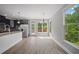 Bright kitchen featuring modern stainless-steel appliances, a breakfast bar, and ample natural light from large windows at 2548 Kickerillo Se Way, Atlanta, GA 30316